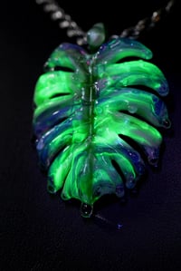 Image 1 of Drippy uv reactive mox color monstera leaf pendant 💦 🌿 