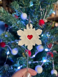 Image 5 of Snowflake with a heart on a wire stake 
