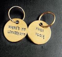 Image 1 of WHITE LOTUS keychains! 