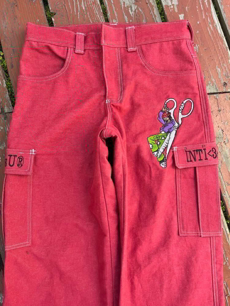 Image of red denim embroidered jeans