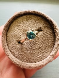 Image 2 of size 6.5 blue zircon ring with sterling twig band