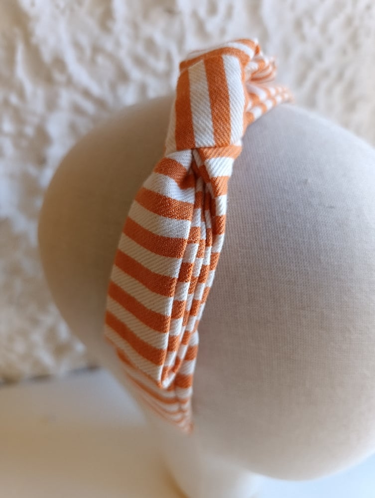 Image of Cerchietto a fiocco righe bianco/arancione