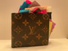 Fake Louis Vuitton Wallet filled with 100 Post it Note Drawings of Depressed Balkan Men 