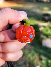 Image 1 of Blue eye small Skull Pumpkin Pendant