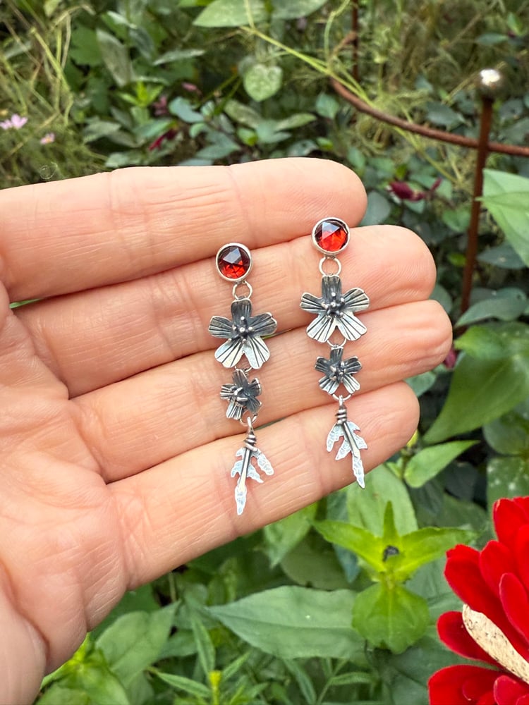 Image of Tiered Signet Marigold Flowers Leaves Garnet Stud Earrings