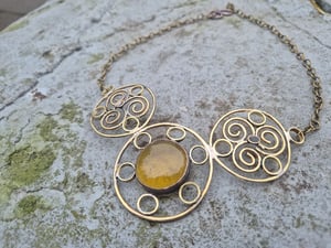 Sun necklace with yellow centre 