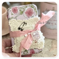 Image 10 of A Petite French tin with a needle book and tattered pin cushion