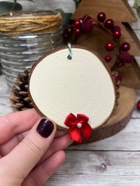 Image 1 of Log slice with bow