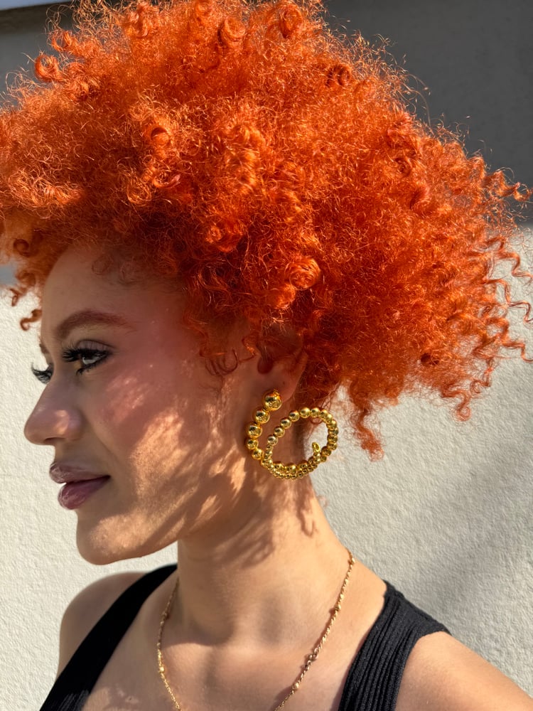 Image of gold spiral hoops