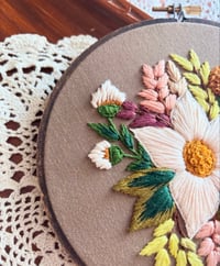 Image 2 of 6” White floral embroidery with green leaves on brown fabric 