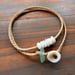 Image of Waterproof 7 tiny pukas choker necklace on hand braided sinew with locking seaglass clasp