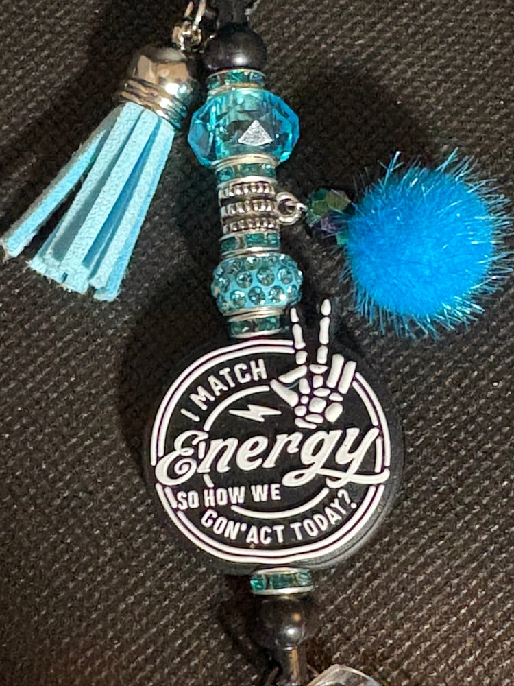 Image of Black and Blue I match energy  Badge Reel with Tassel