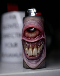 Image 16 of Faded Face Bic Lighter Sleeve