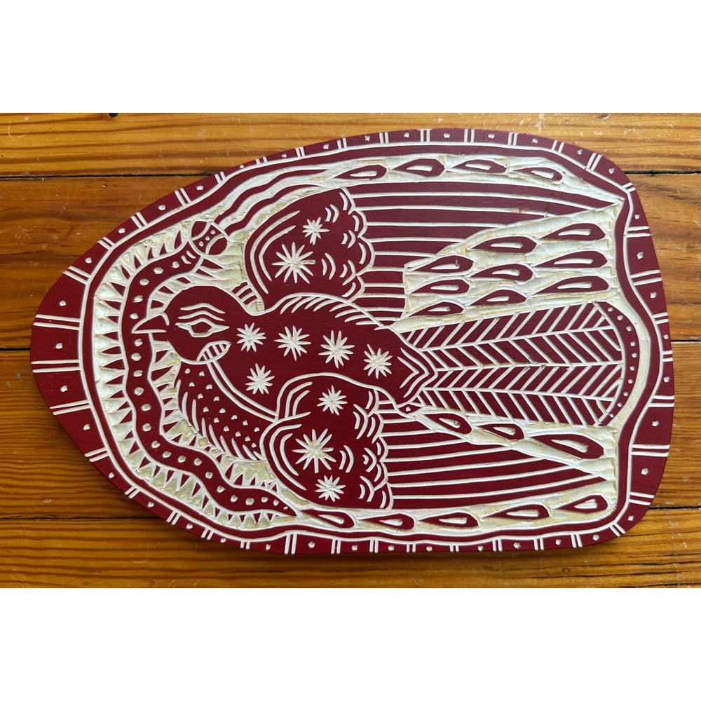 Image of Deep Red Bug Catching Bird