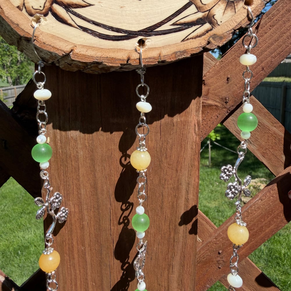 Image of trad flower ring hanging beaded wall art 