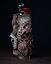 Image 1 of Face Off collectible lighter sleeve, original sculpt, functional art OOAK