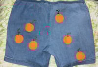 Image 2 of orange jorts