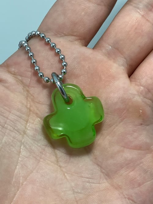 Image of green over green plus 