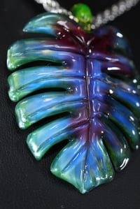 Image 1 of purple/blue/green layered color monstera leaf pendant 💜🌿