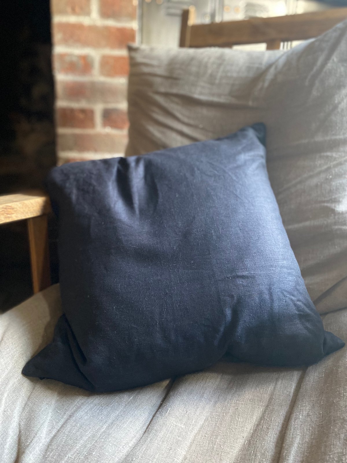 Image of Black linen embroidered cushion