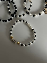 Image 6 of Wild Blooms Black, Gold, and Cream Tumbler Bracelet Stack
