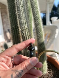 Image 1 of “black out days” mushroom pendant