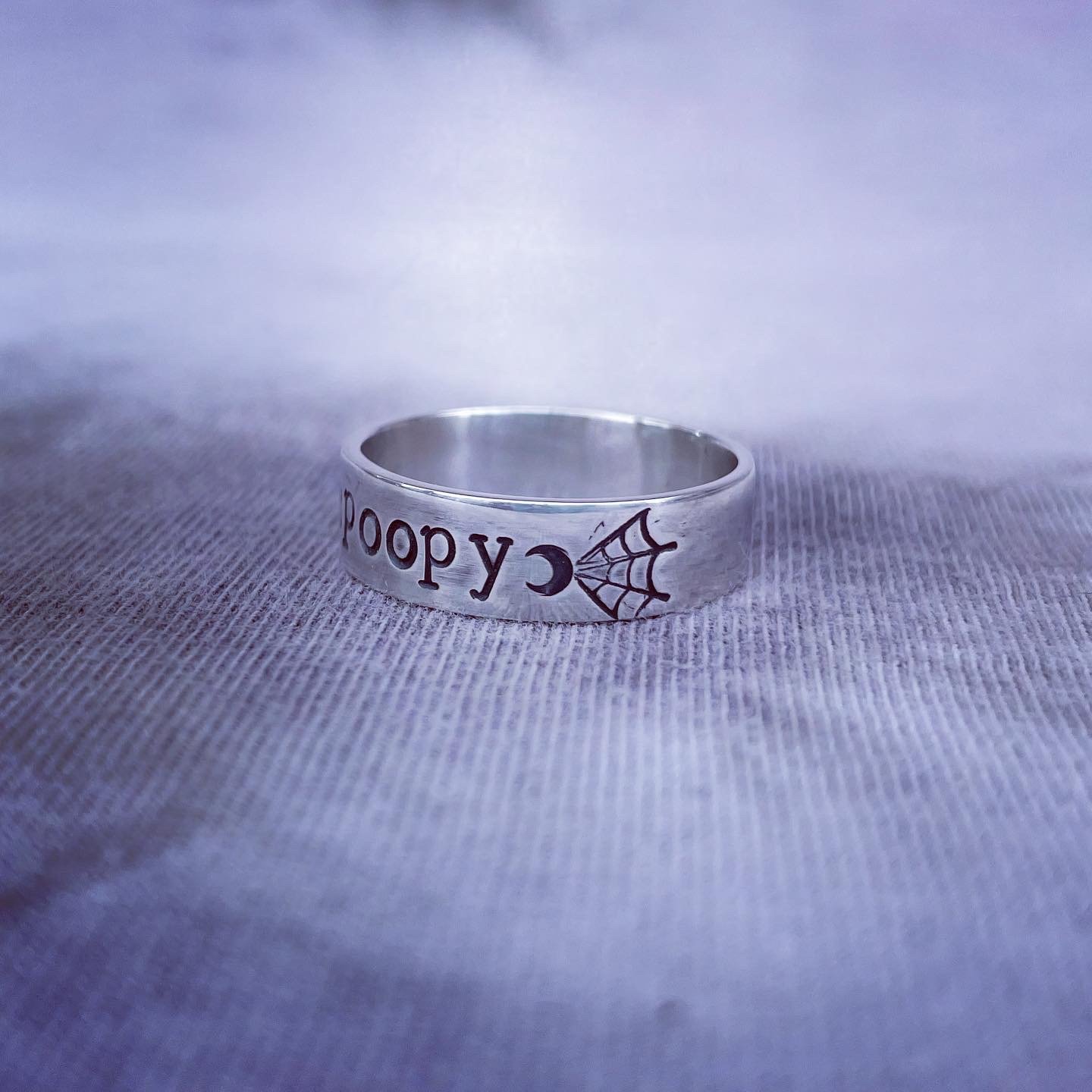 Image of Spooky silver ring with moon and spider web stamps. Spooky halloween silver 925 ring.