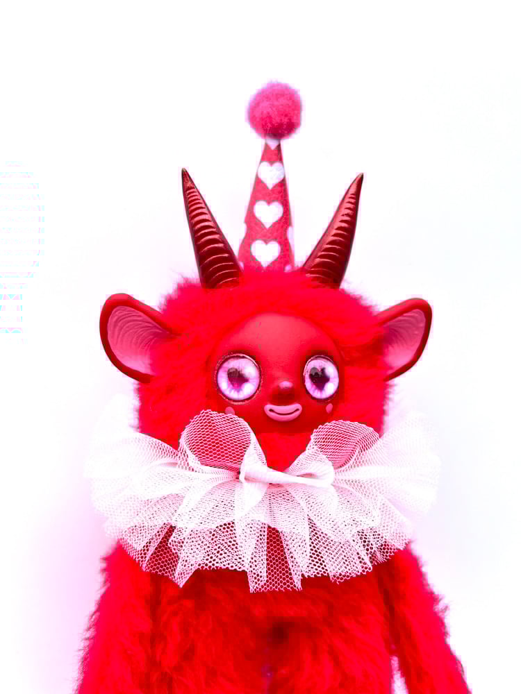 Red Creature with white ruffle
