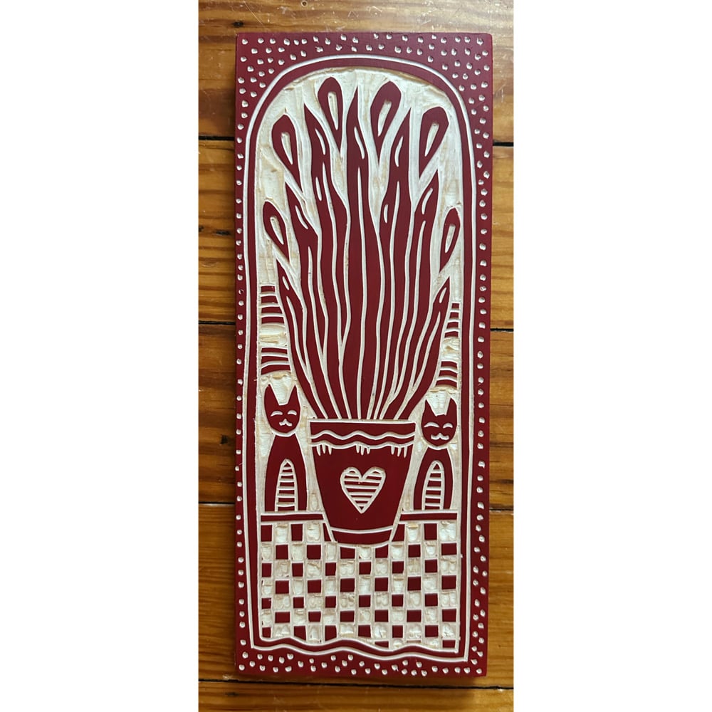 Image of Deep Red Plant and Two Cats