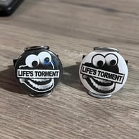 Image 1 of Life’s Torment 1.25” Button