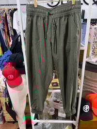 Image 1 of green joggers 