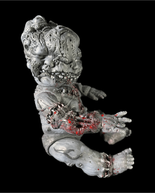 Image of Grayscale & blood Autopsy Baby (in jar)
