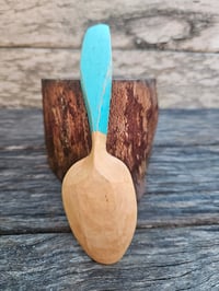 Image 2 of Schinus eating spoon. 