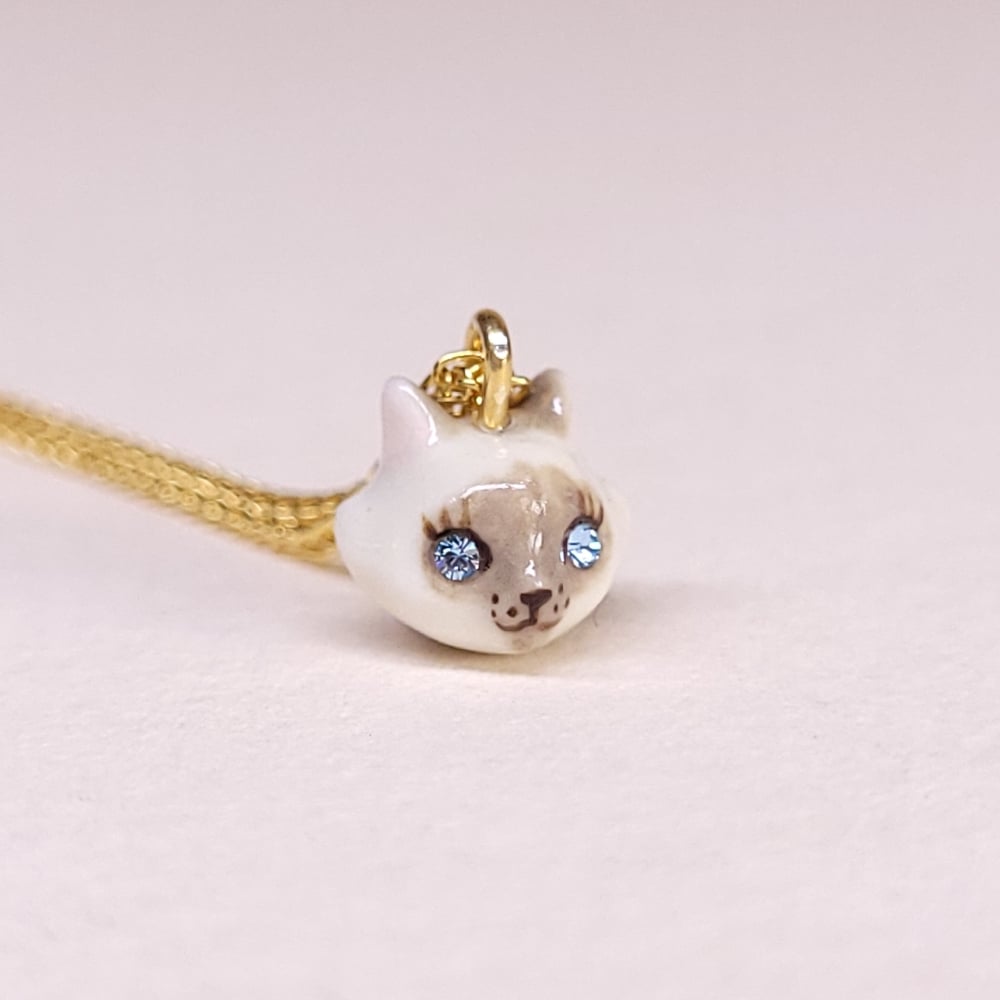 Image of Siamese Porcelain & Gold Vermeil Teeny Tiny Cat Pendant