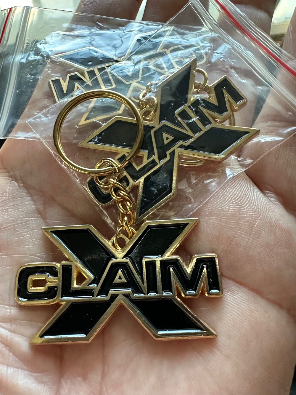 Shiny Gold “xclaim" logo metal Keychain