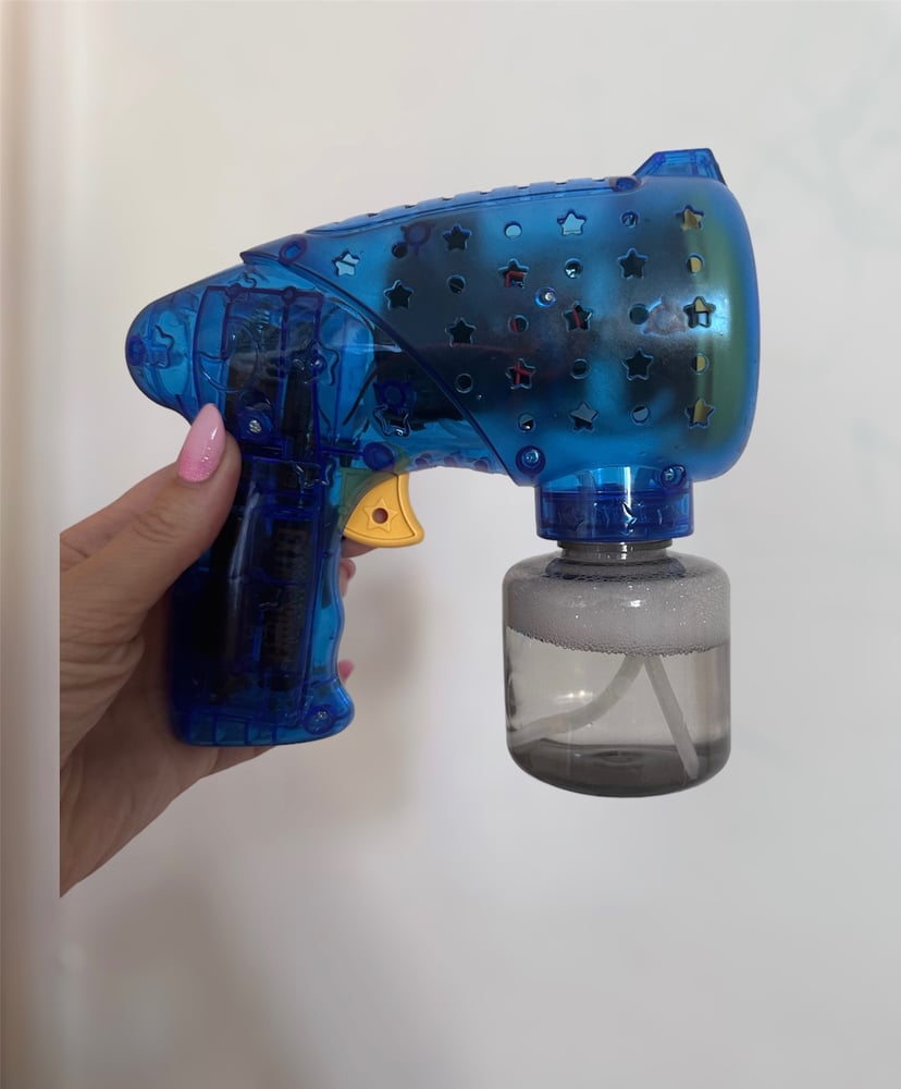 Image of Hand held. bubble Machine