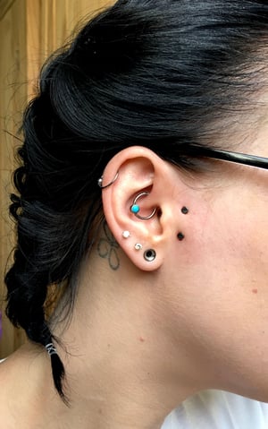 SURFACE TRAGUS PIERCING SERVICES