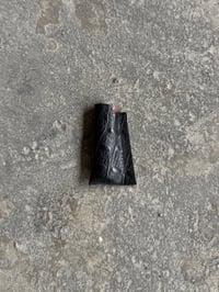 Image 1 of ASYMMETRICAL LIGHTERCASE BLACK