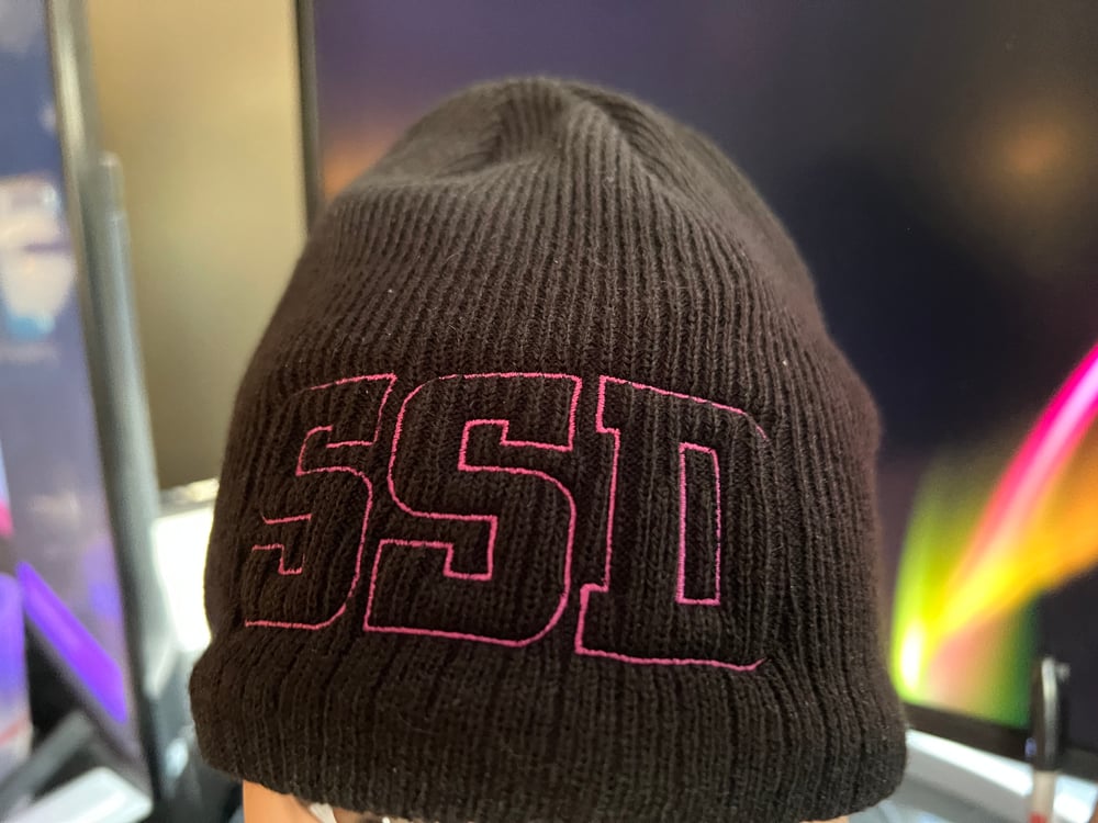 Black New Era Knit beanie hat with Magenta SSD Outline logo 