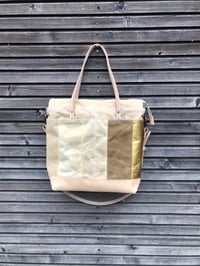 Image 5 of  Large tote bag in waxed canvas and leather with cross body strap 