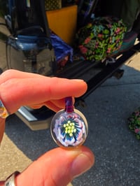 Image 1 of Fully uv reactive flower pendant. 