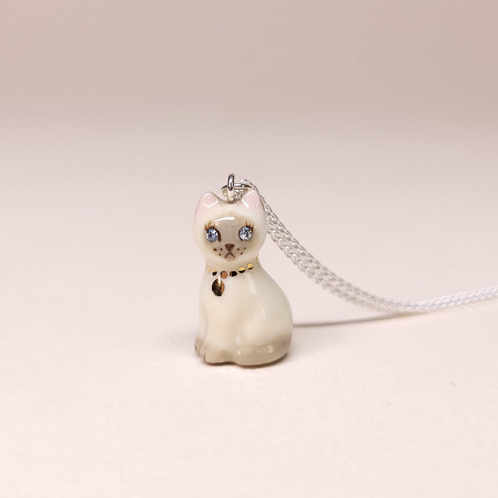 Image of Siamese Porcelain & Sterling Silver Sitting Kitten Pendant