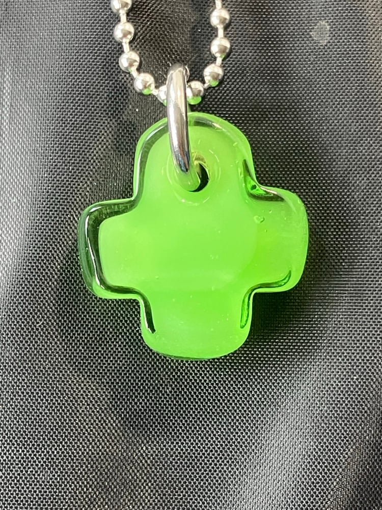 Image of green over green plus 