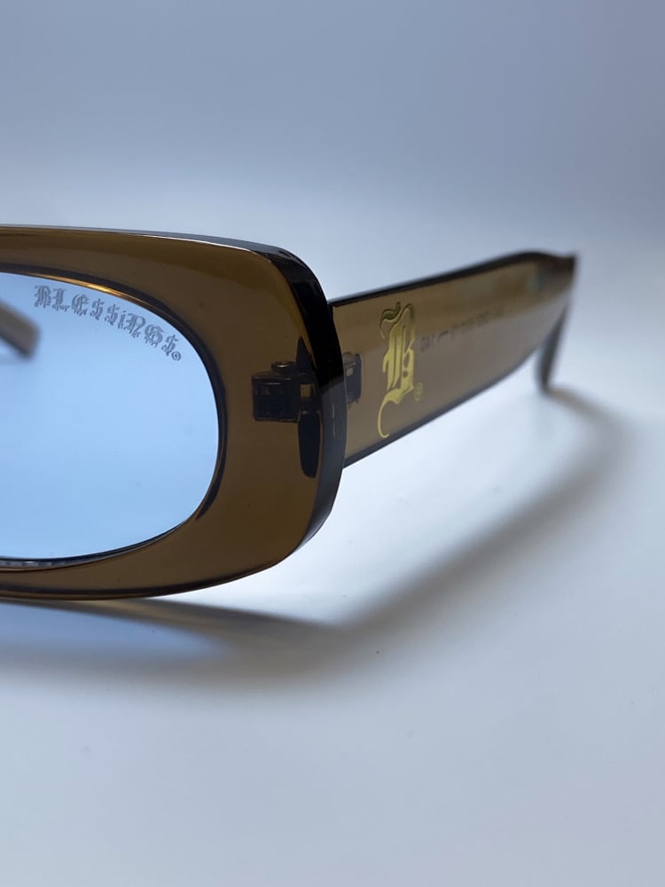 Image of BLE$$ING$®️ CLEAR BRN FRAMES / BLUE TINT