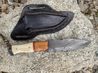 Image 3 of 512 layer Damascus knife with cross body sheath.