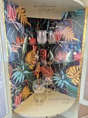 Image of Nathan Corner Drinks Cabinet unit with botanical lining.