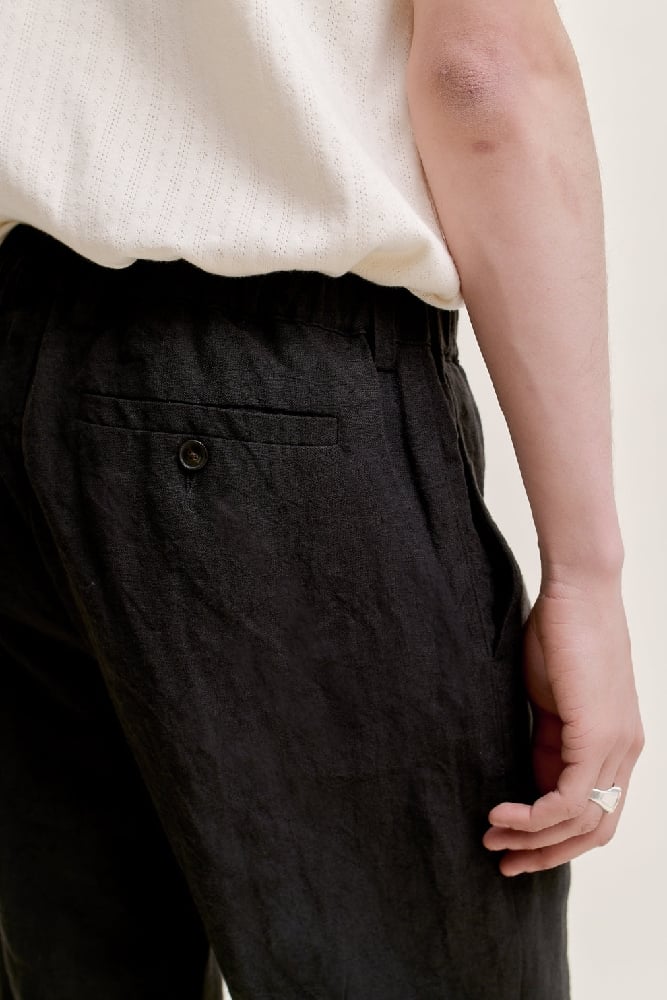 Image of A KIND OF GUISE ELASTICATED WIDE TROUSERS MYSTIC BLACK