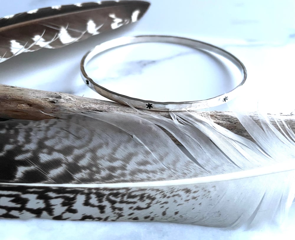 Image of Celestial Sterling silver hand stamped star bangle 925. Hand stamped starry bracelet.