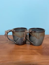 Image 1 of M43 2 matching mugs green and caramel 