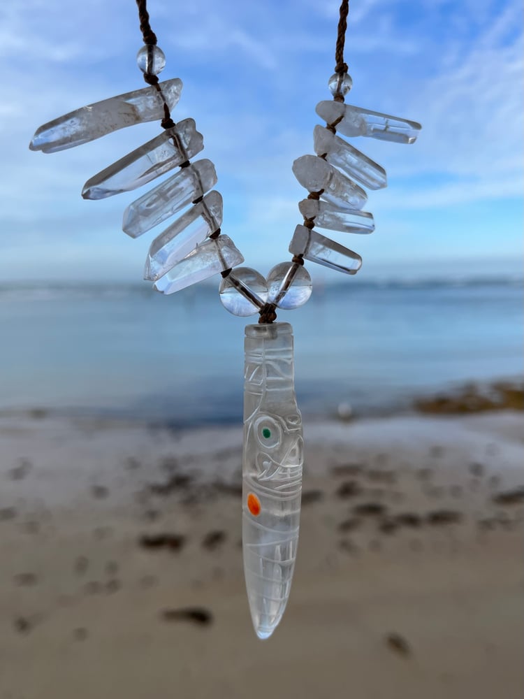 Image of Macrame pendant with carved clear quartz